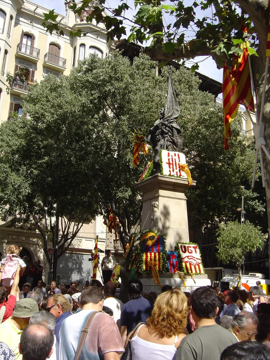 Crowds with Catalan flags gather at the monument to Rafael Casanova in Barcelona on the Diada, 11 September
