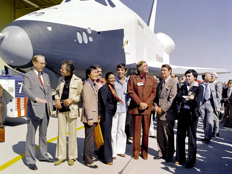 The shuttle Enterprise at its roll-out in Palmdale, California, with NASA officials and members of the cast of Star Trek