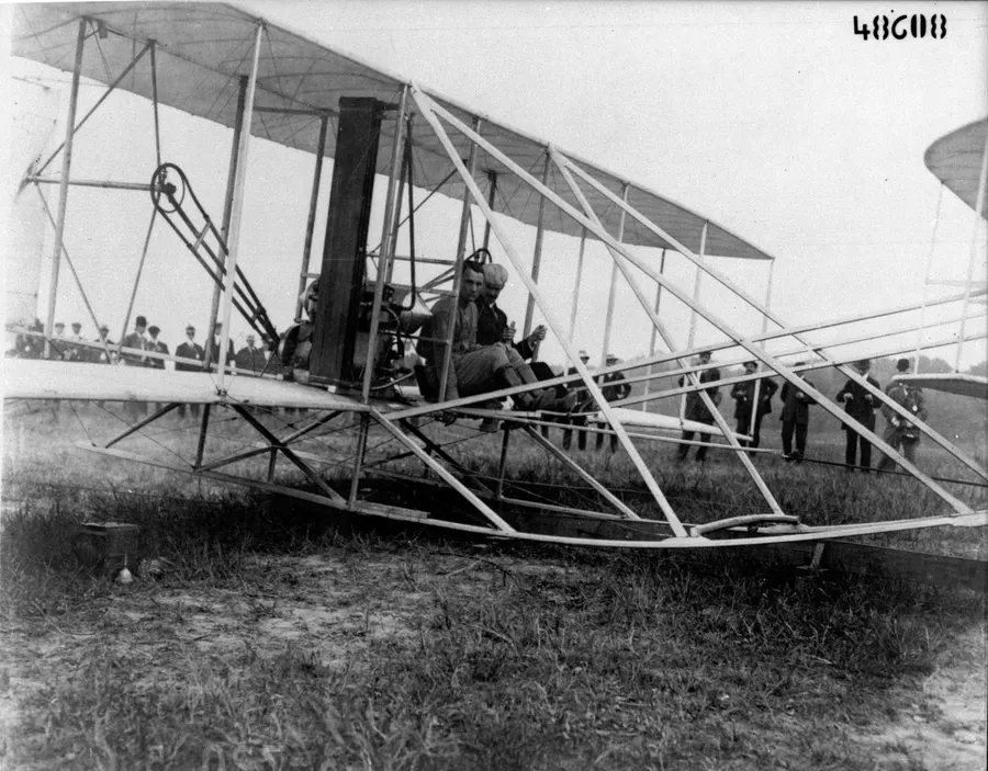 Orville Wright and Lieutenant Thomas Selfridge seated in the Wright aeroplane at Fort Myer before their flight