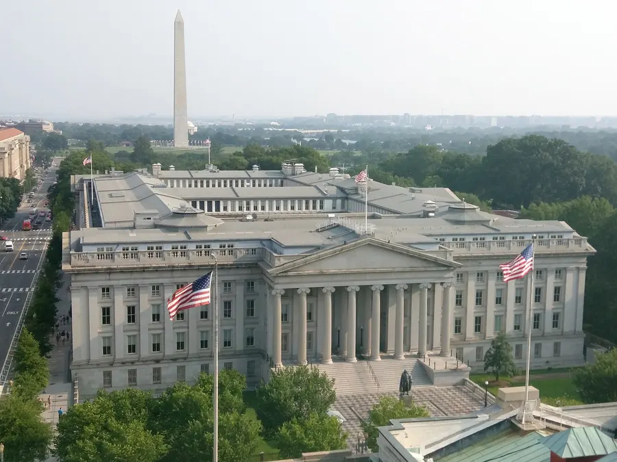 The US Treasury Building in Washington, DC, with the Washington Monument behind
