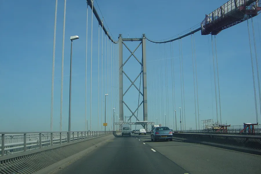 Driving across the Forth Road Bridge over the Firth of Forth, north-west of Edinburgh, in 2005