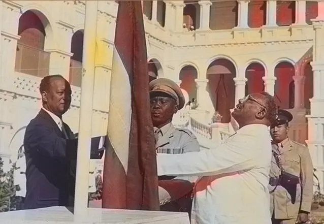 The prime minister, Ismail al-Azhari, and the opposition leader Mohamed Ahmed Mahgoub raise Sudan's flag at the independence ceremony, 1 January 1956.