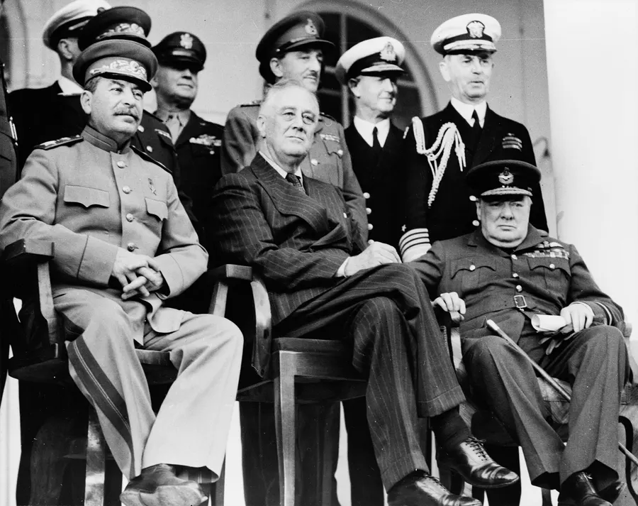 Stalin, Roosevelt and Churchill with their chiefs of staff on the portico of the Soviet embassy in Tehran, 1943.