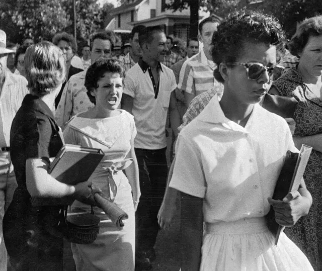 Elizabeth Eckford faces a hostile crowd outside Central High School on 4 September 1957, three weeks before the troops arrived.