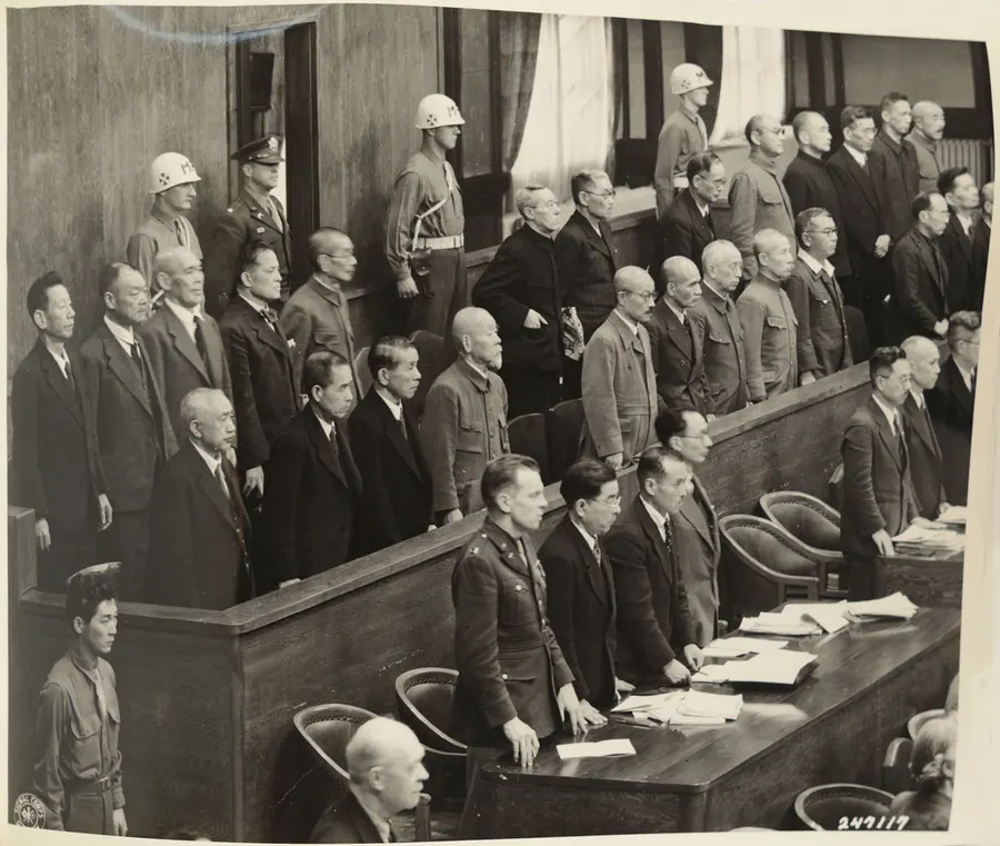 The accused stand as the judges enter the courtroom of the Tokyo tribunal, May 1946.