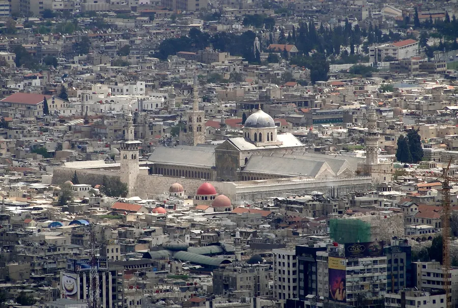The Umayyad Mosque rising above the rooftops of the old city of Damascus