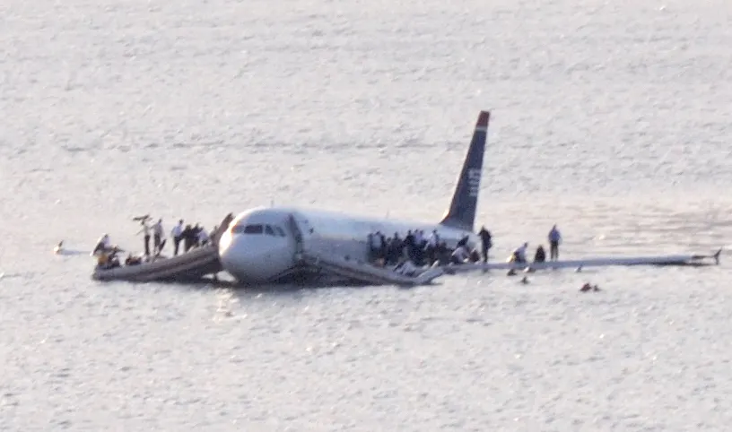 US Airways Flight 1549 in the Hudson River on 15 January 2009, with passengers standing on the wings.