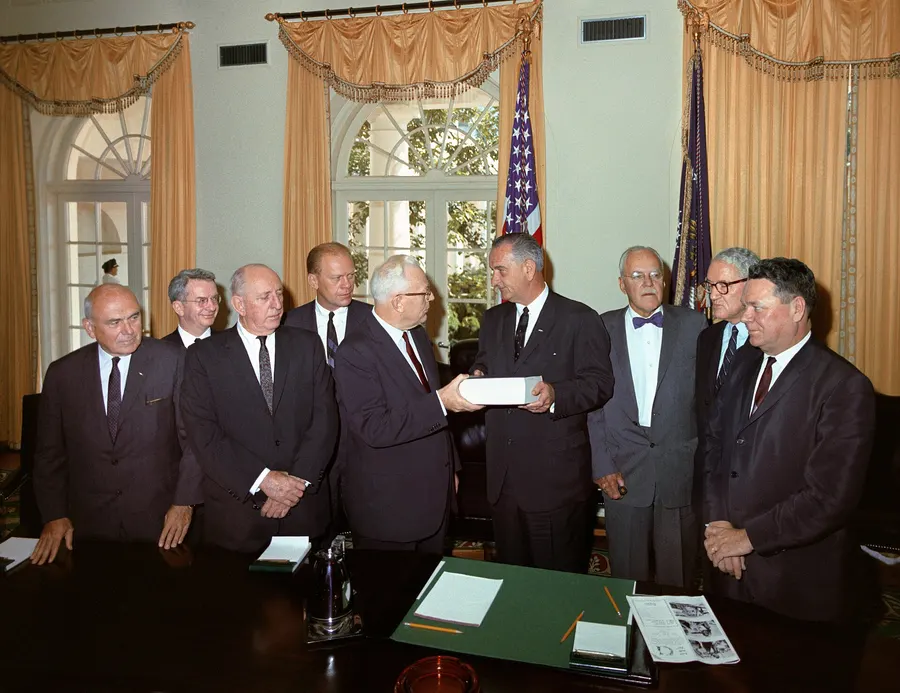 Members of the Warren Commission present their report to President Johnson at the White House, 24 September 1964.