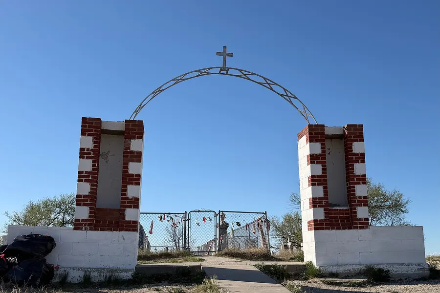 The entrance to the cemetery at Wounded Knee, South Dakota, where the victims were buried; the monument stands at the centre.